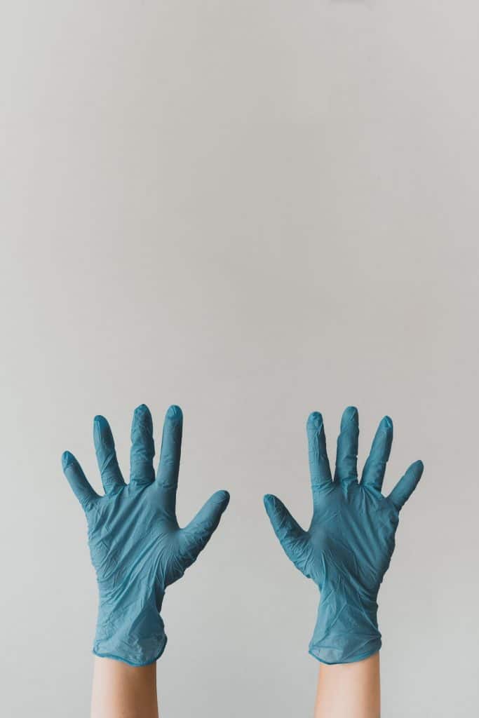 Covid Quarantine Cleaning Services Covid Quarantine Cleaning Services - Cleaner wearing Rubber Gloves